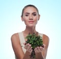 Happy young woman with a bundle of fresh mint. Concept vegetarian dieting - healthy food