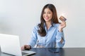 Happy young woman buying things online with copy space, using smartphone, laptop and credit card, enjoying shopping in internet. Royalty Free Stock Photo