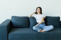 Happy young woman caller talking on the phone at home Royalty Free Stock Photo