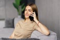 Happy young woman caller talking on the phone at home Royalty Free Stock Photo