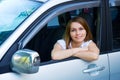 Happy young woman in a car Royalty Free Stock Photo