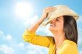 Happy young woman with charming smile against blue sky. Royalty Free Stock Photo