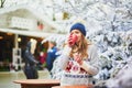 Happy young woman on Christmas market in Paris  France Royalty Free Stock Photo