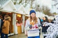 Happy young woman on Christmas market in Paris  France Royalty Free Stock Photo
