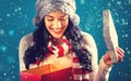 Happy young woman with Christmas present box Royalty Free Stock Photo