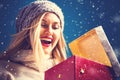 Happy young woman with Christmas present box Royalty Free Stock Photo