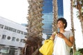 Happy young woman in the city listening music on mobile phone Royalty Free Stock Photo