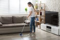 Young Woman Cleaning The Hardwood Floor Royalty Free Stock Photo