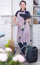 Young woman with vacuum cleaner Royalty Free Stock Photo