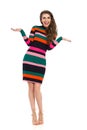 Happy Young Woman In Colorful Mini Dress Is Gesturing Royalty Free Stock Photo