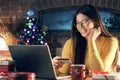 Happy woman buying Christmas gifts online Royalty Free Stock Photo