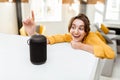 Woman controlling smart home devices with a voice commands