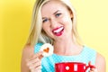 Happy young woman with cookie and coffee Royalty Free Stock Photo
