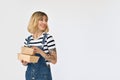 Happy young woman customer holding lunch boxes excited with fast food delivery.