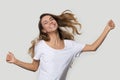 Happy young woman dancing, feeling excited, jumping, having fun Royalty Free Stock Photo