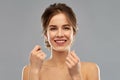 Happy young woman with dental floss cleaning teeth Royalty Free Stock Photo