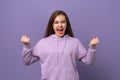 Happy young woman doing victory sign with arms raised, smiling and screaming for success. Celebration concept Royalty Free Stock Photo