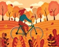 Happy young woman dressed in autumn clothes riding a bicycle with forest background. Leaves flying around in wind
