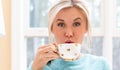 Happy young woman drinking coffee Royalty Free Stock Photo