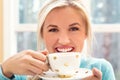 Happy young woman drinking coffee Royalty Free Stock Photo