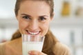 Happy young woman drinking milk Royalty Free Stock Photo