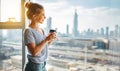 Happy young woman drinks coffee in morning at window Royalty Free Stock Photo