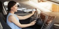 Happy young woman driving car on sunny day. Banner design Royalty Free Stock Photo