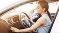 Happy young woman driving car on sunny day Royalty Free Stock Photo
