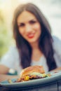 Happy young woman eat tasty fast food burger Royalty Free Stock Photo