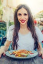 Happy young woman eat tasty fast food burger Royalty Free Stock Photo