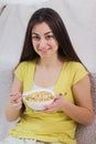 Happy Young Woman Eating Cereal Breakfast Royalty Free Stock Photo