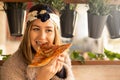 Happy young woman eating pizza in the restaurant Royalty Free Stock Photo