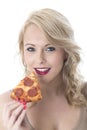 Happy Young Woman Eating Pizza Slice Royalty Free Stock Photo