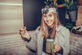 Happy young woman eating a slice of pizza and drinking lemonade Royalty Free Stock Photo