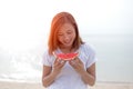 Happy young woman eating watermelon on the beach. Youth lifestyle. Happiness, joy, holiday, beach, Royalty Free Stock Photo