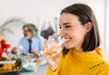 Happy young woman enjoying dinner party with family at home Royalty Free Stock Photo