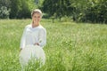 Happy Young Woman Enjoying Summer on the Green Meadow. Royalty Free Stock Photo