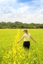 Happy Young Woman Enjoying Summer And Nature In Yellow Flower Field With Sunlight, Harmony And Healthy Lifestyle. Field Of Yellow Royalty Free Stock Photo