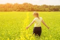 Happy Young Woman Enjoying Summer And Nature In Yellow Flower Field With Sunlight, Harmony And Healthy Lifestyle. Field Of Yellow Royalty Free Stock Photo