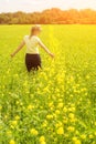 Happy Young Woman Enjoying Summer And Nature In Yellow Flower Field With Sunlight, Harmony And Healthy Lifestyle. Field Of Yellow Royalty Free Stock Photo