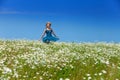 The happy young woman in the field of camomiles Royalty Free Stock Photo