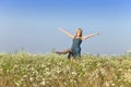 The happy young woman in the field of camomiles Royalty Free Stock Photo