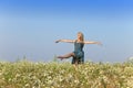 The happy young woman in the field of camomiles Royalty Free Stock Photo