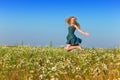 The happy young woman in the field of camomiles Royalty Free Stock Photo