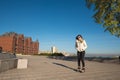 Happy young woman in a funny sunglasses roller skating in the pa Royalty Free Stock Photo