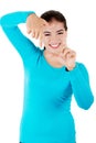 Happy young woman gesturing frame Royalty Free Stock Photo