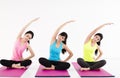 Happy young woman Group doing yoga exercises Royalty Free Stock Photo