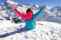 Happy young woman with hands up enjoying in snowy winte on the topof the mountain Royalty Free Stock Photo