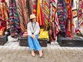 Old traditional Turkish carpet shop in cave house Cappadocia, Turkey Kapadokya. Young woman on vacation in Turkey Royalty Free Stock Photo