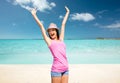 Happy young woman in hat on summer beach Royalty Free Stock Photo